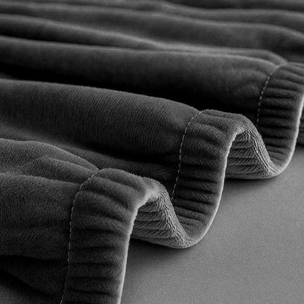 Elegant sofa cover i mørkegrå velour til hjørnesofaer