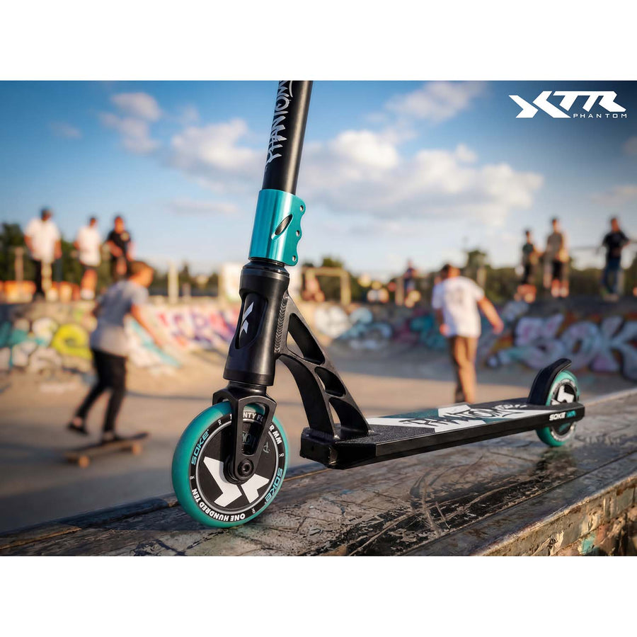 Stunt-løbehjul med HIC-kompression, T-bar-styr og 110 mm Hollow Core-hjul – sort og turkis